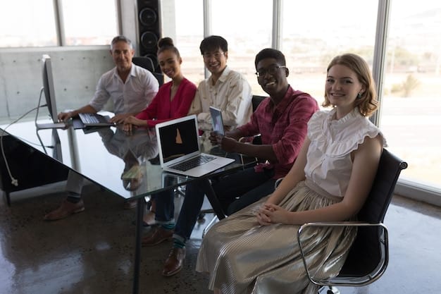 A diverse group of adults participating in a job training program, learning new skills related to data analysis and software development. The image showcases the importance of reskilling initiatives for adapting to the changing job market.