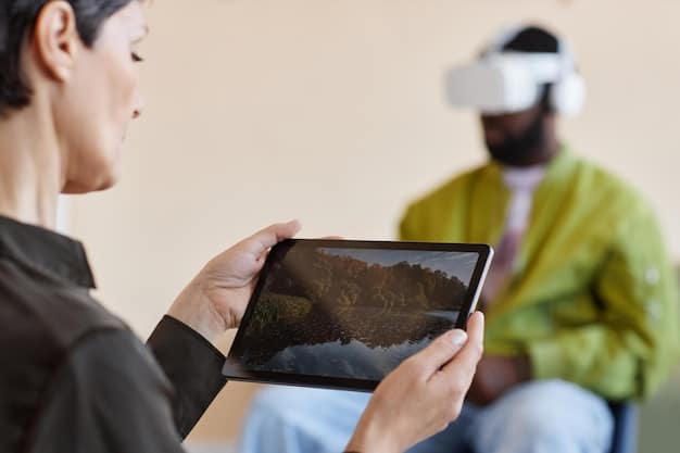 A therapist guiding a US veteran through a virtual reality exposure therapy session. The screen behind them displays the virtual environment the veteran is experiencing, which represents a controlled traumatic scenario. The therapist is actively listening and providing support.