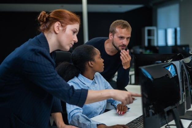 A group of employees participating in a cybersecurity training session. The instructor is demonstrating a phishing attack scenario, while the employees are actively learning how to identify and avoid such threats.