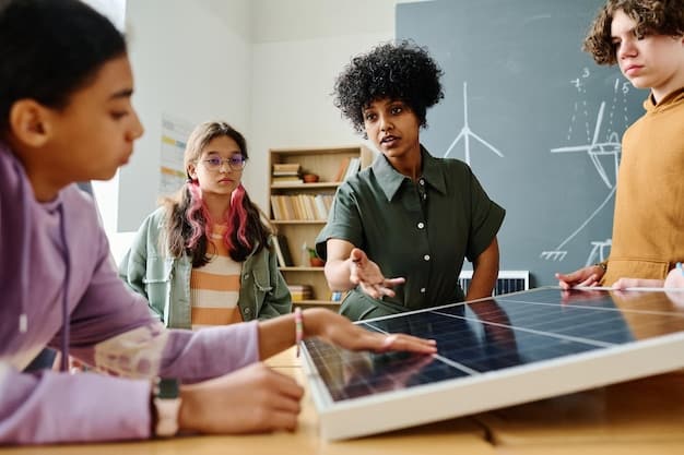 Students in a science class working on a solar energy project. They are building a small solar panel prototype, with the teacher providing guidance. Digital tablets and science journals are on the desk.