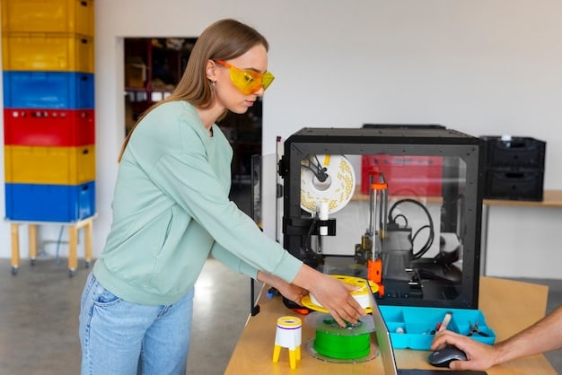 A high school student is carefully using a 3D printer to create a small plastic object. The printer is in a well-equipped lab, with various other pieces of technology visible in the background.