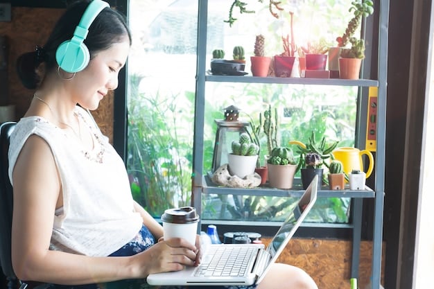A student working independently in a quiet study area with noise-canceling headphones, surrounded by books and plants. The area is well-lit and designed for focused concentration.