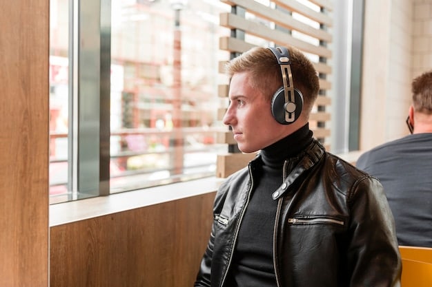A close up of a person talking on a clear headset in a modern office environment. The background is blurred, focusing attention on the communication aspect.