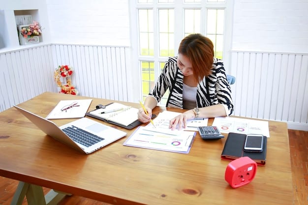 A person organizing their home finances. A calculator, checkbook, bank statements and pen are all on a table in an office.