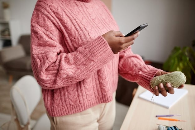 A person using a budgeting app on their smartphone to track expenses.