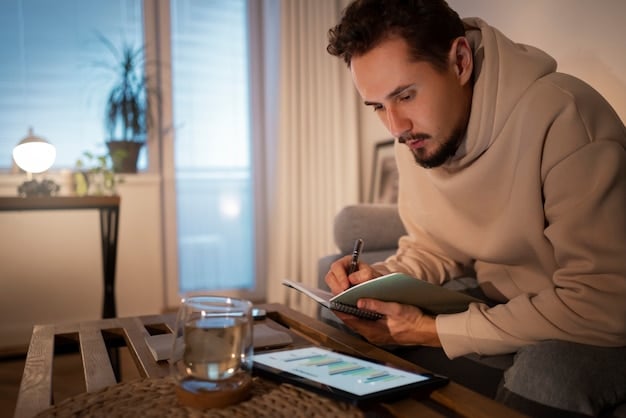 A person using a budgeting app on their smartphone while sitting on a couch, highlighting the use of technology in managing expenses and tracking savings progress.