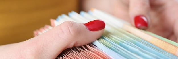 A close-up of a hand organizing receipts and financial documents, with highlighted sections on expenses related to childcare services, emphasizing meticulous documentation.